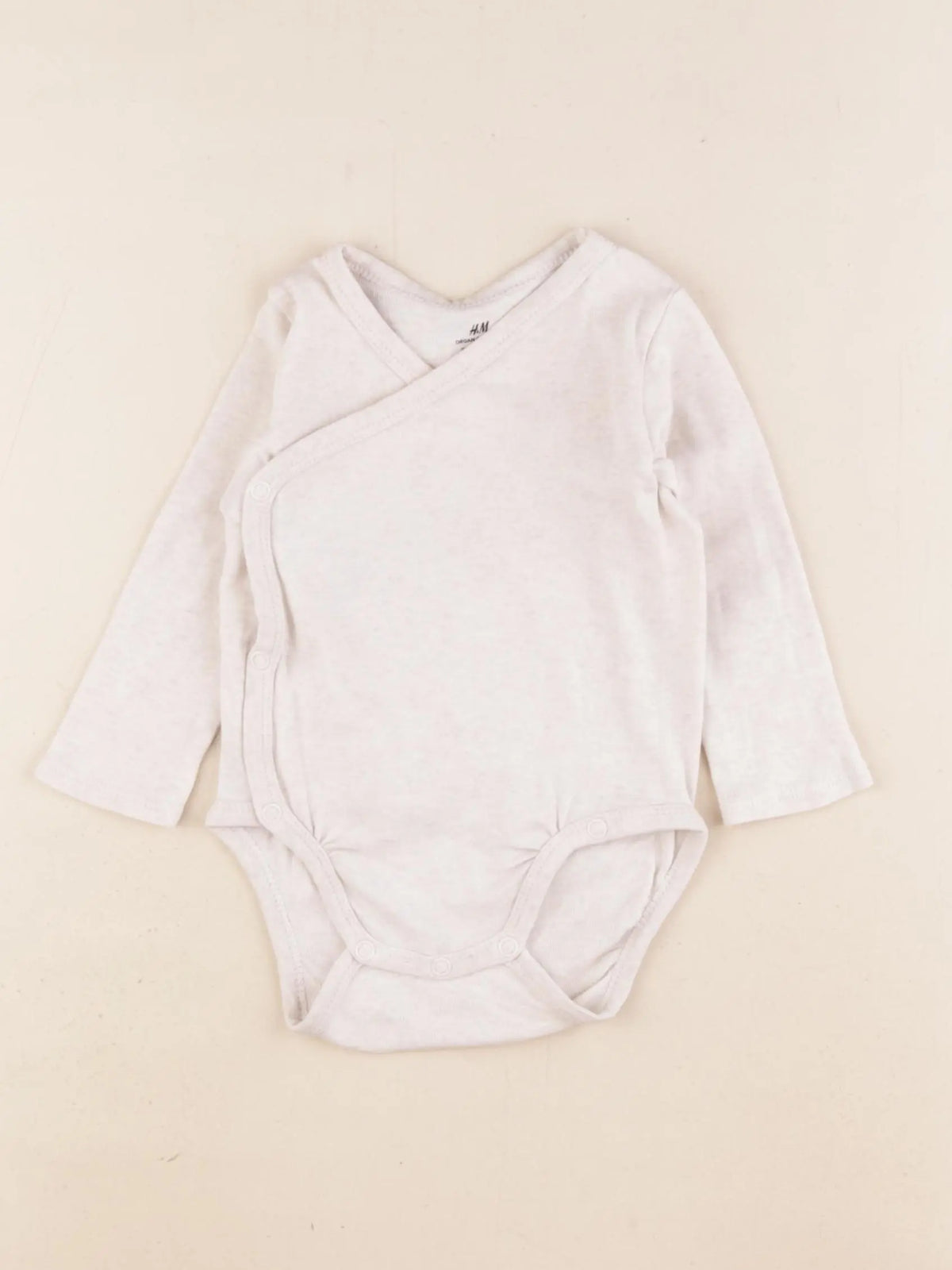 H&M - body beige - 4/6 mois