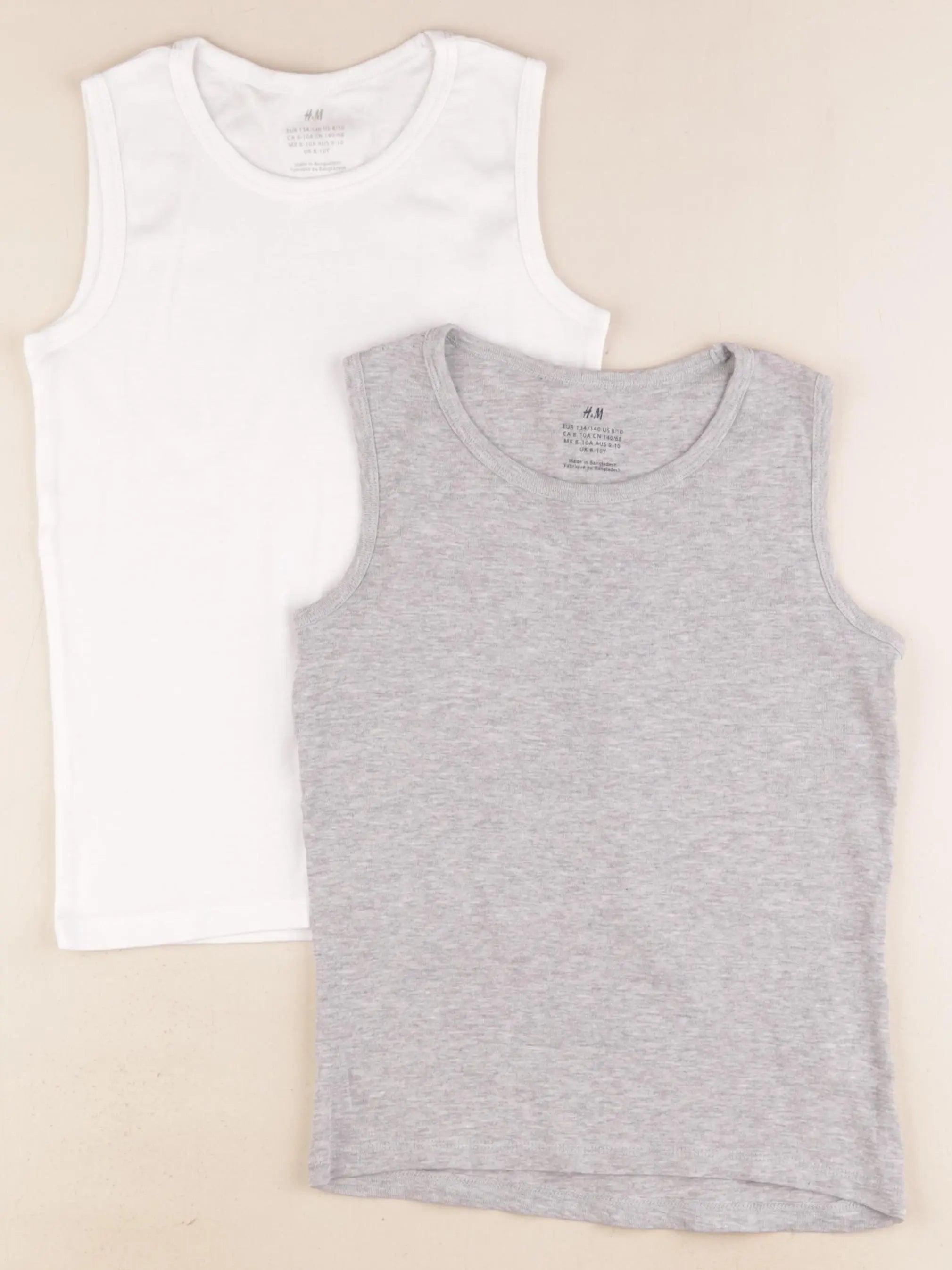 H&M - lot de 2 bodies en coton gris, blanc - 8/10 ans