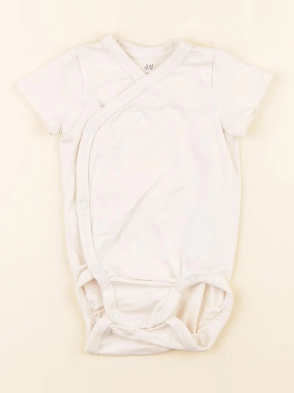 H&M - body beige - 2/4 mois