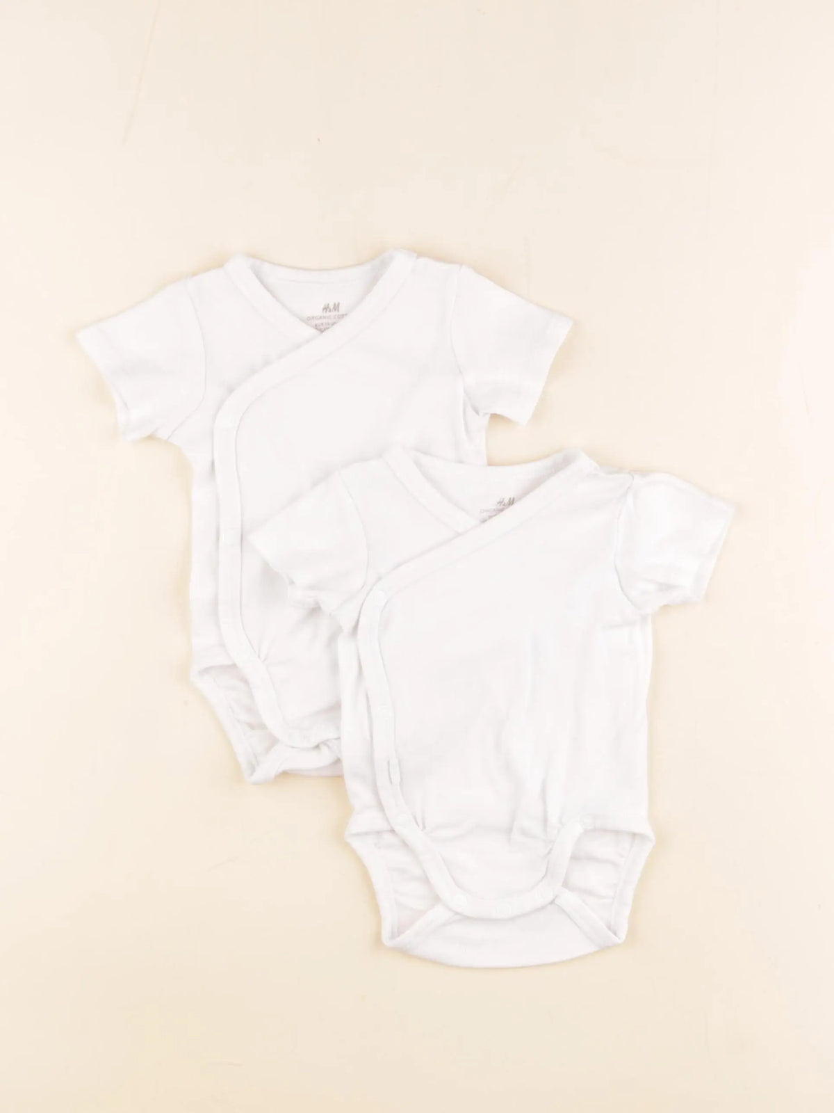 H&M - lot de 2 bodies en coton blanc - 1/2 mois