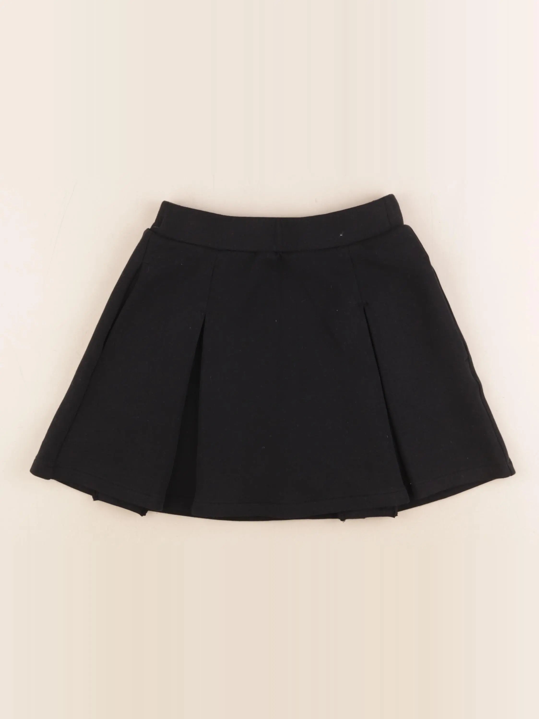 Uniqlo - jupe short noir - 7/8 ans