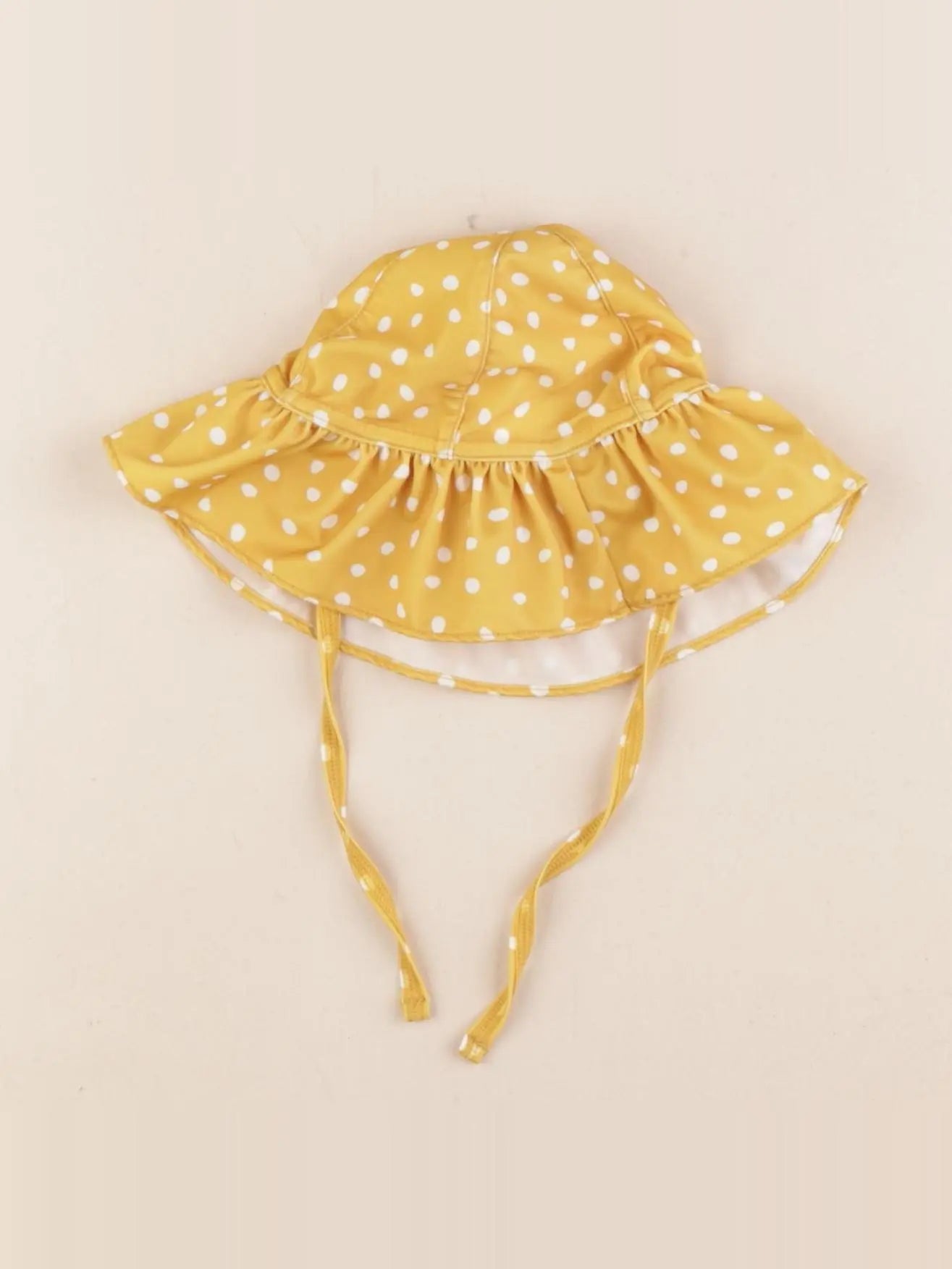 H&M - chapeau jaune - 3/6 mois