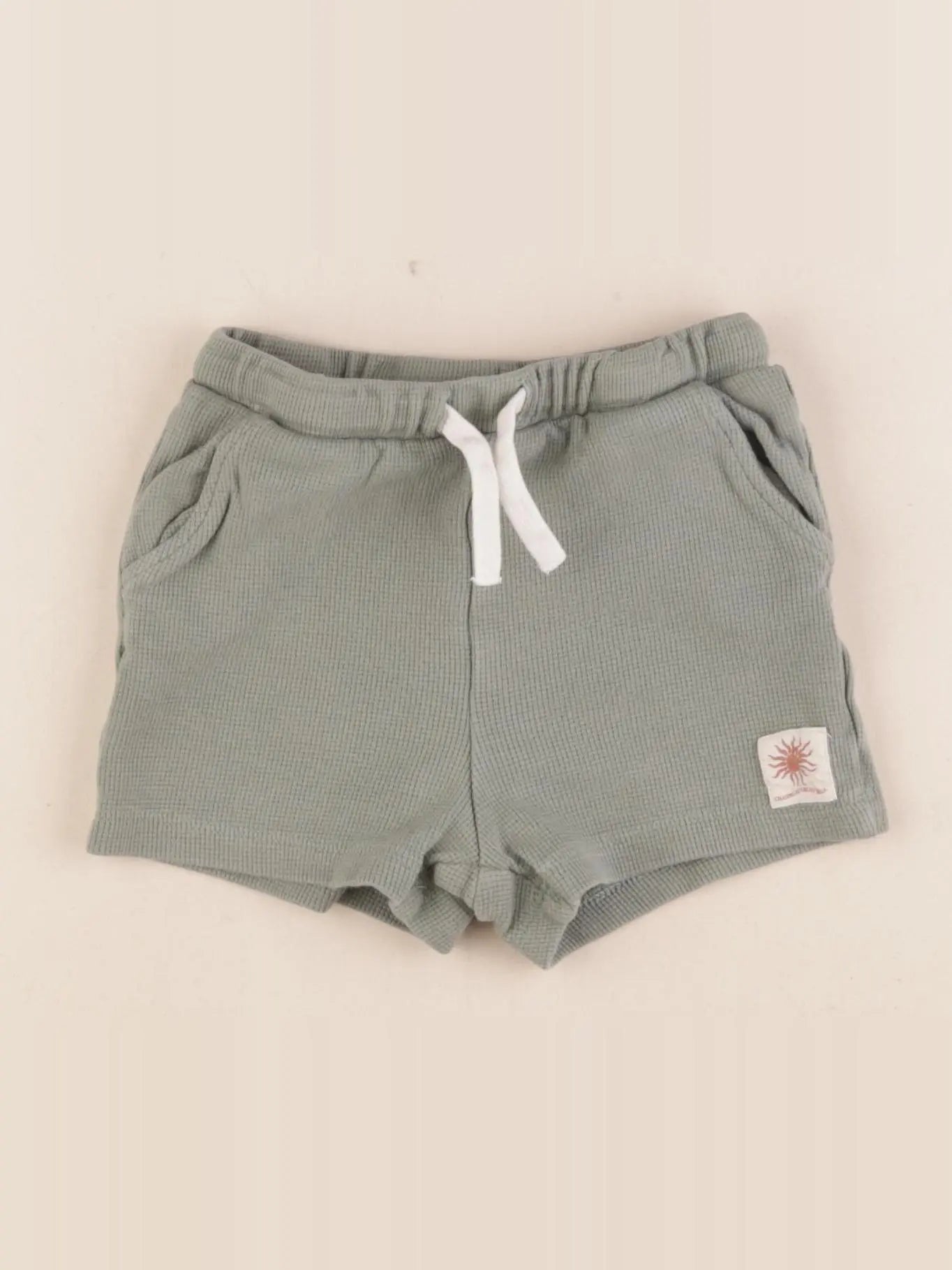 H&M - short vert - 12/18 mois