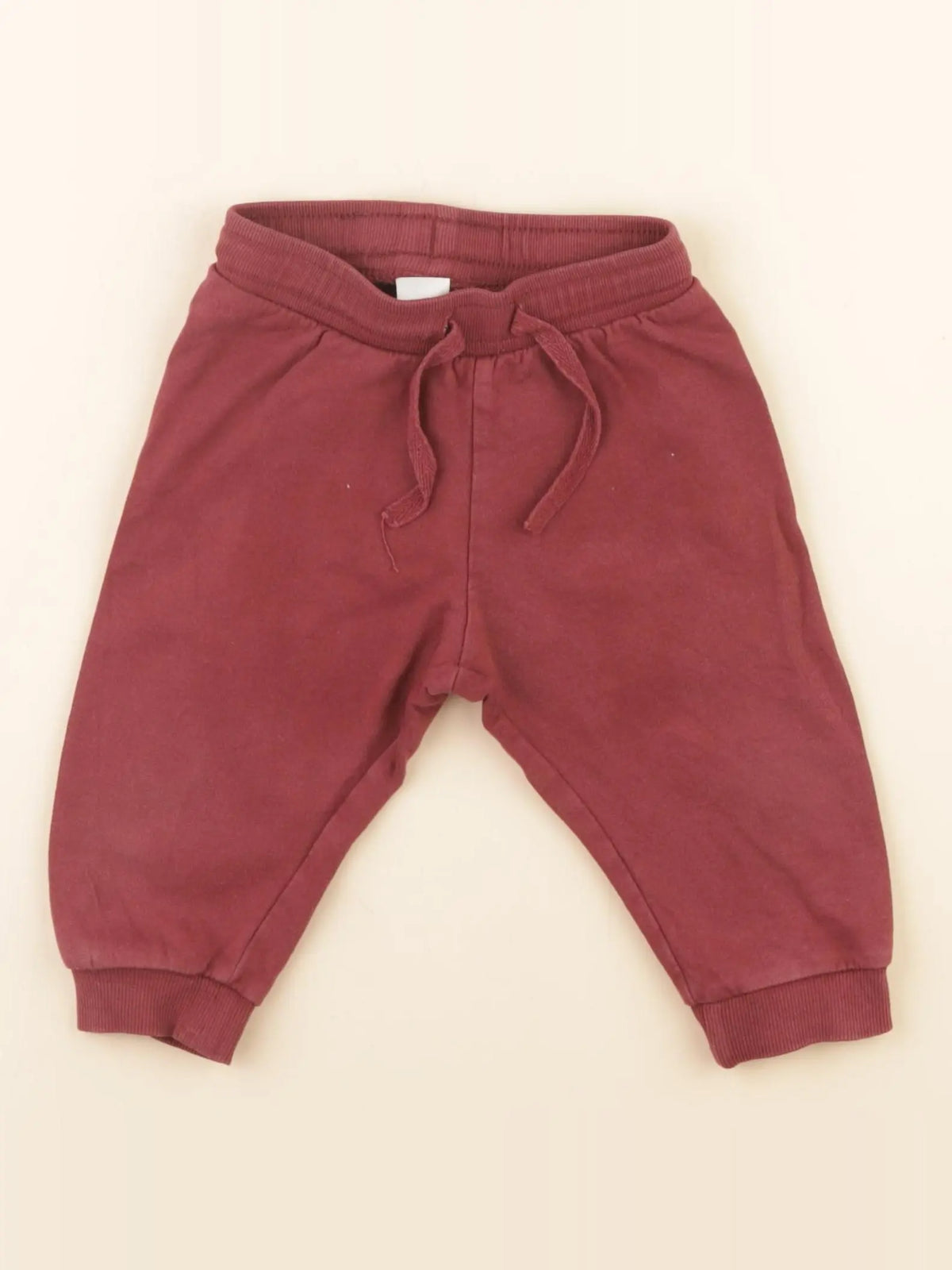H&M - jogging rouge - 6/9 mois
