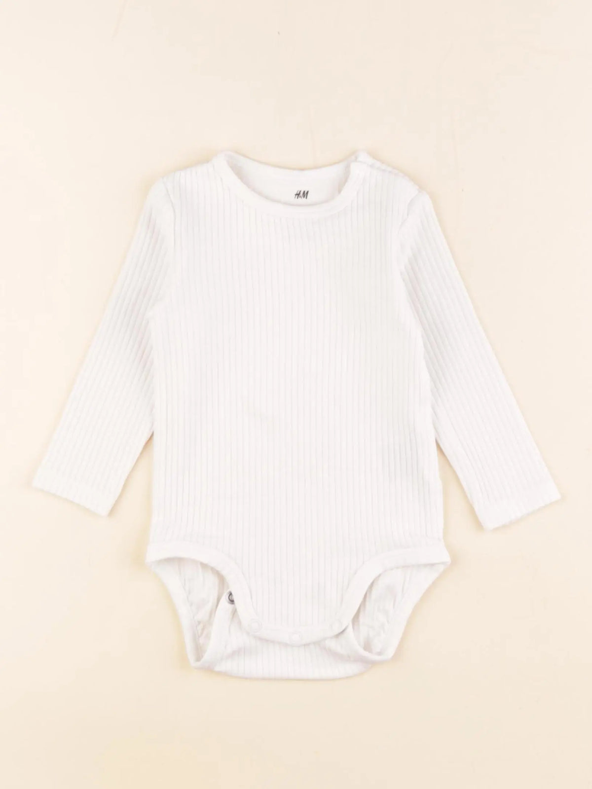 H&M - body beige - 2/4 mois