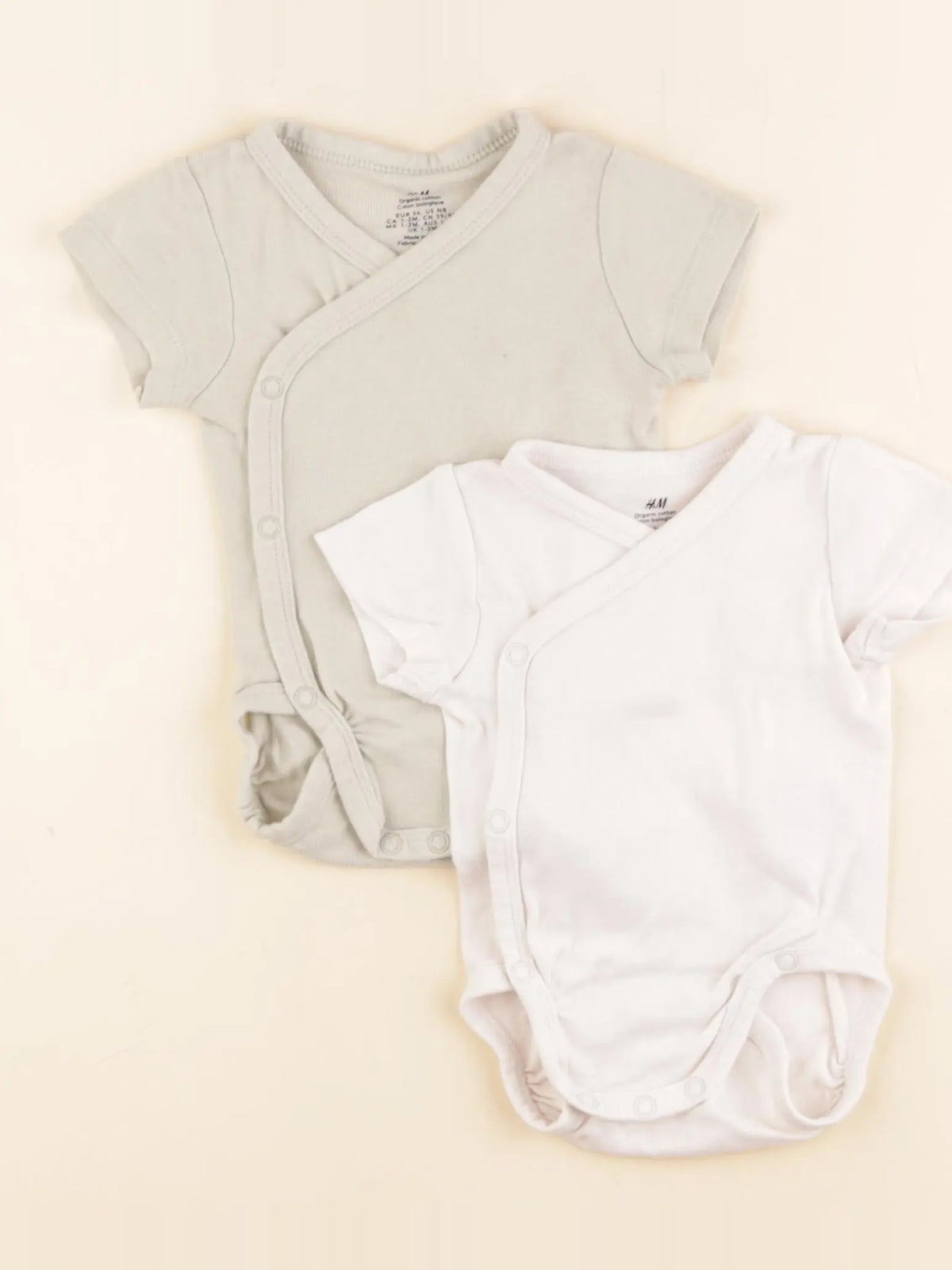 H&M - lot de 2 bodies en coton rose, vert - 1/2 mois
